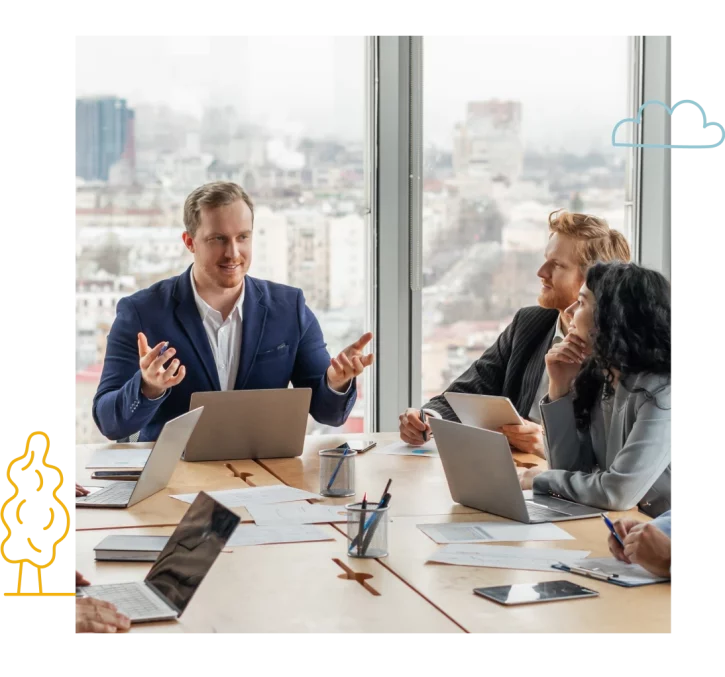 A-group-of-business-professionals-gather-around-a-large-conference-table-in-office A-group-of-business-professionals-gather-around-a-large-conference-table-in-office